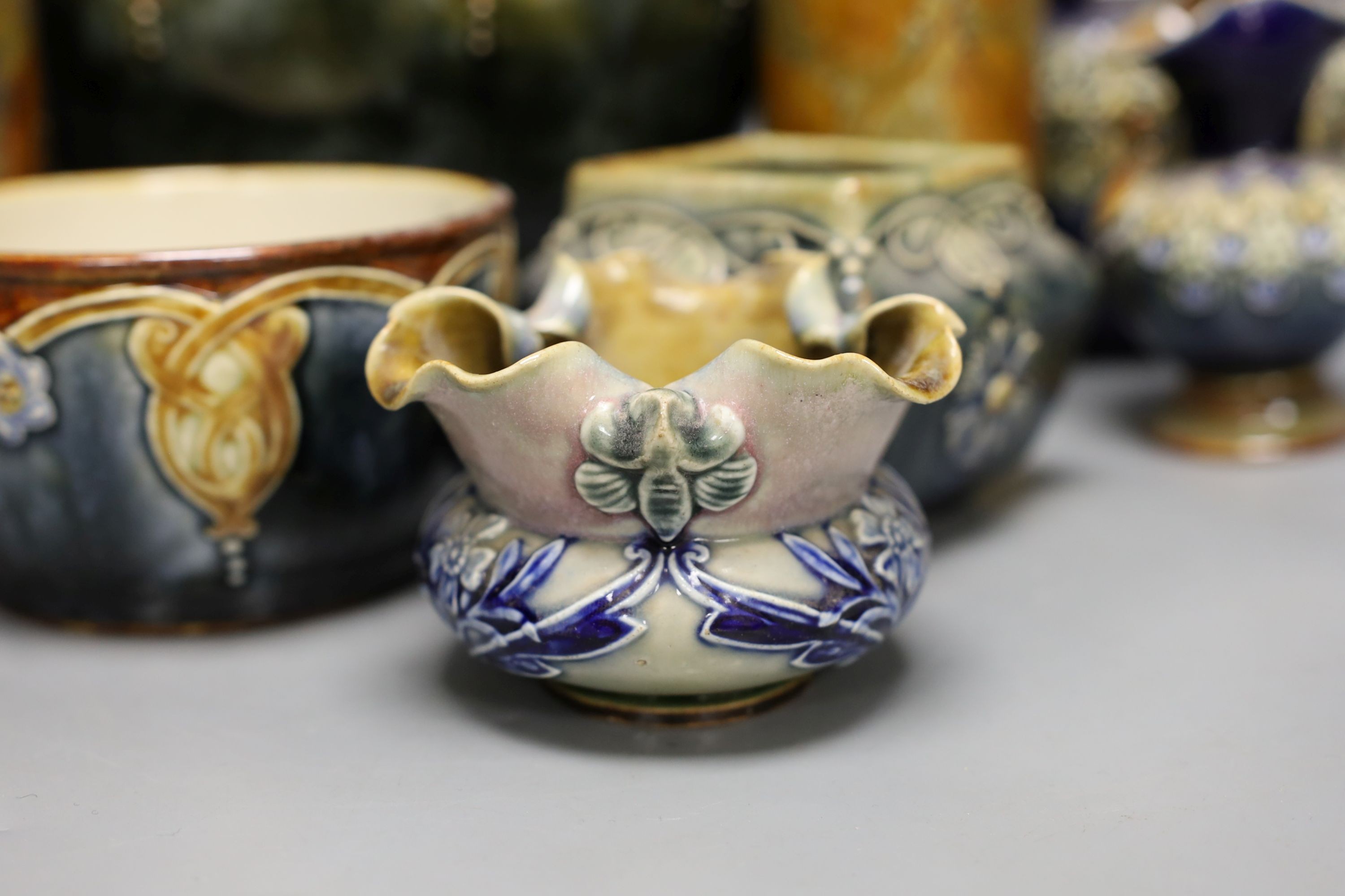 10 pieces of Doulton Lambeth stoneware including a jardiniere, vases etc, largest item jardiniere, 19 cms diameter.